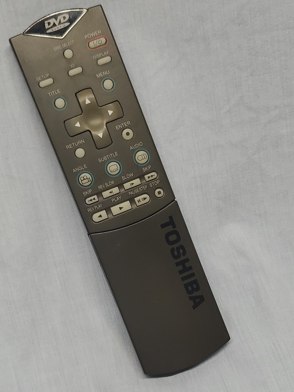 Toshiba dark gray DVD player remote with tan buttons